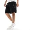 Calvin Klein Shadow Embossed Logo Jersey Shorts In Black For Men Ck Black