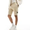 Calvin Klein Jeans Jersey Badge Shorts In Beige For Men Pale Khaki